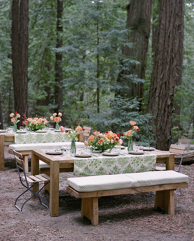 Beautiful set up of dining tables outdoors in woods