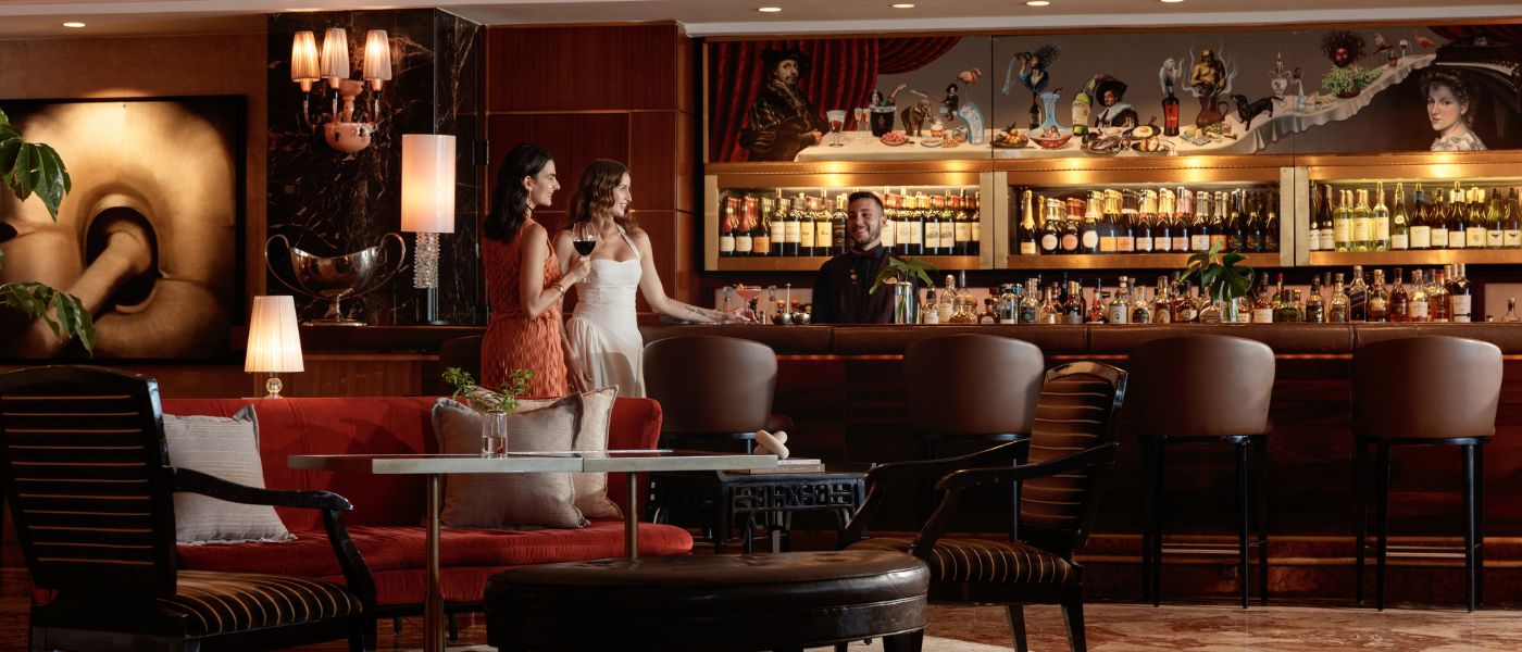 A bartender with patrons