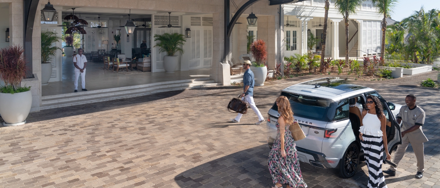 A group walking at the hotel entrance